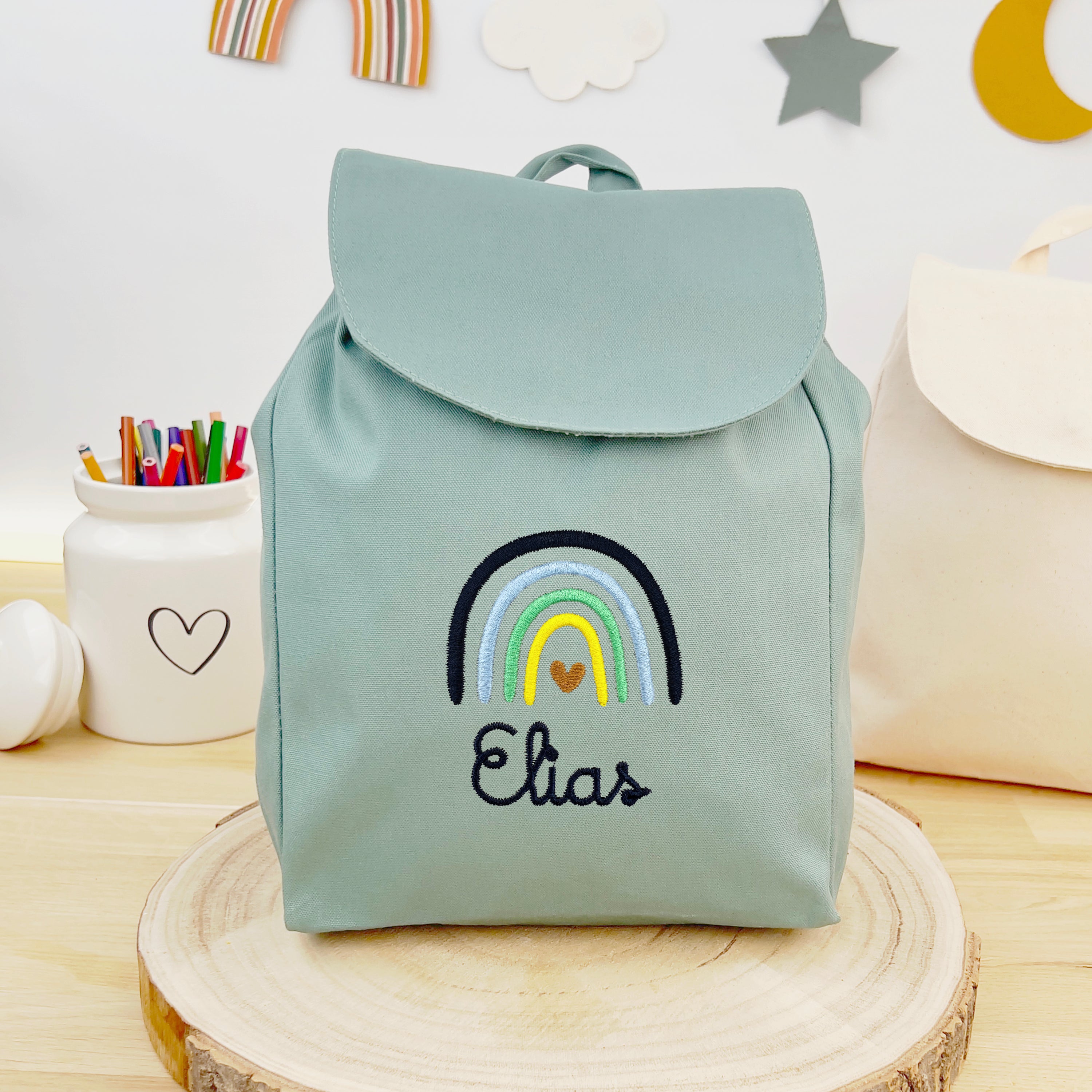 Bio Kinderrucksack mit Namen und Regenbogen - Mint/Navy