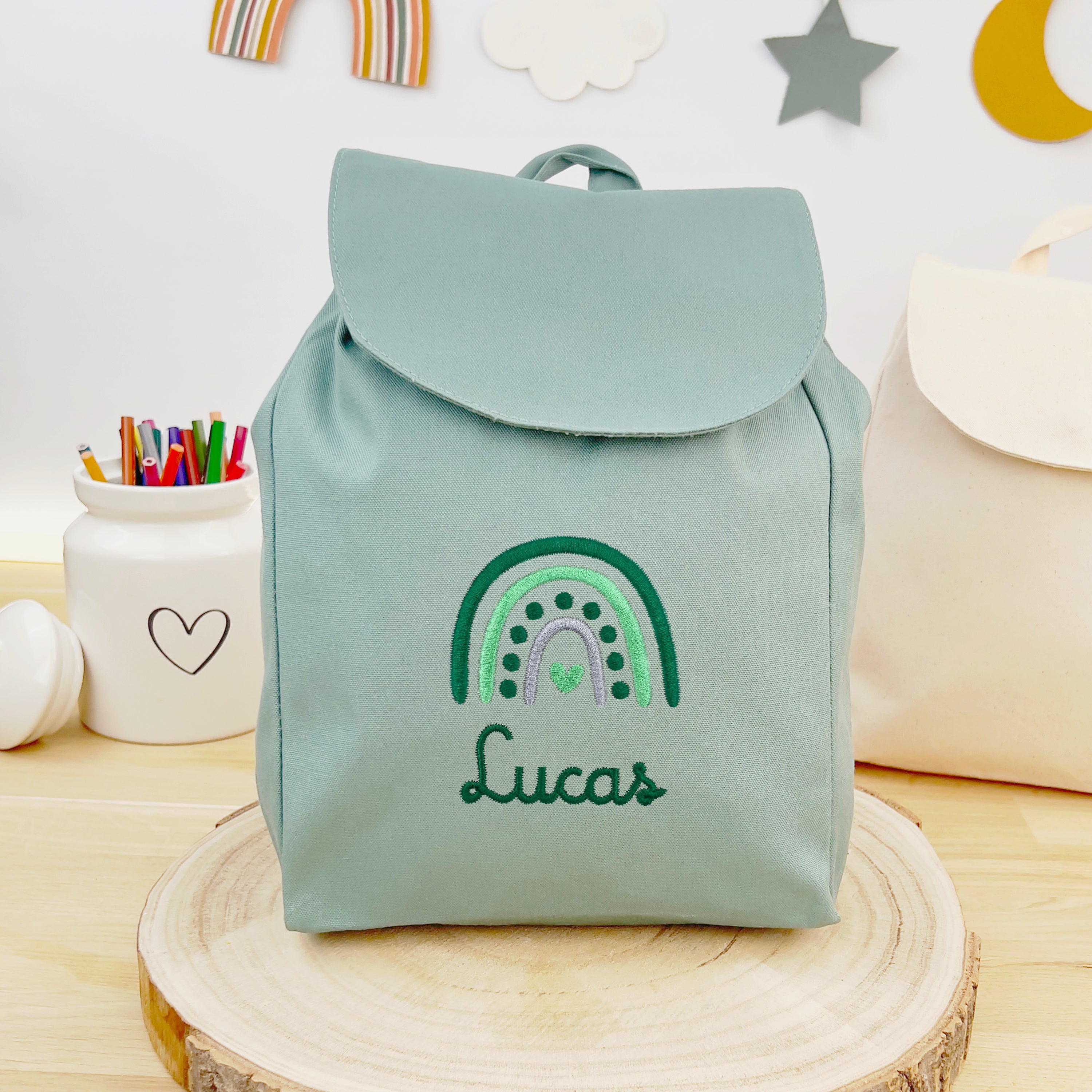 Bio Kinderrucksack mit Namen und Regenbogen - Mint/Grün