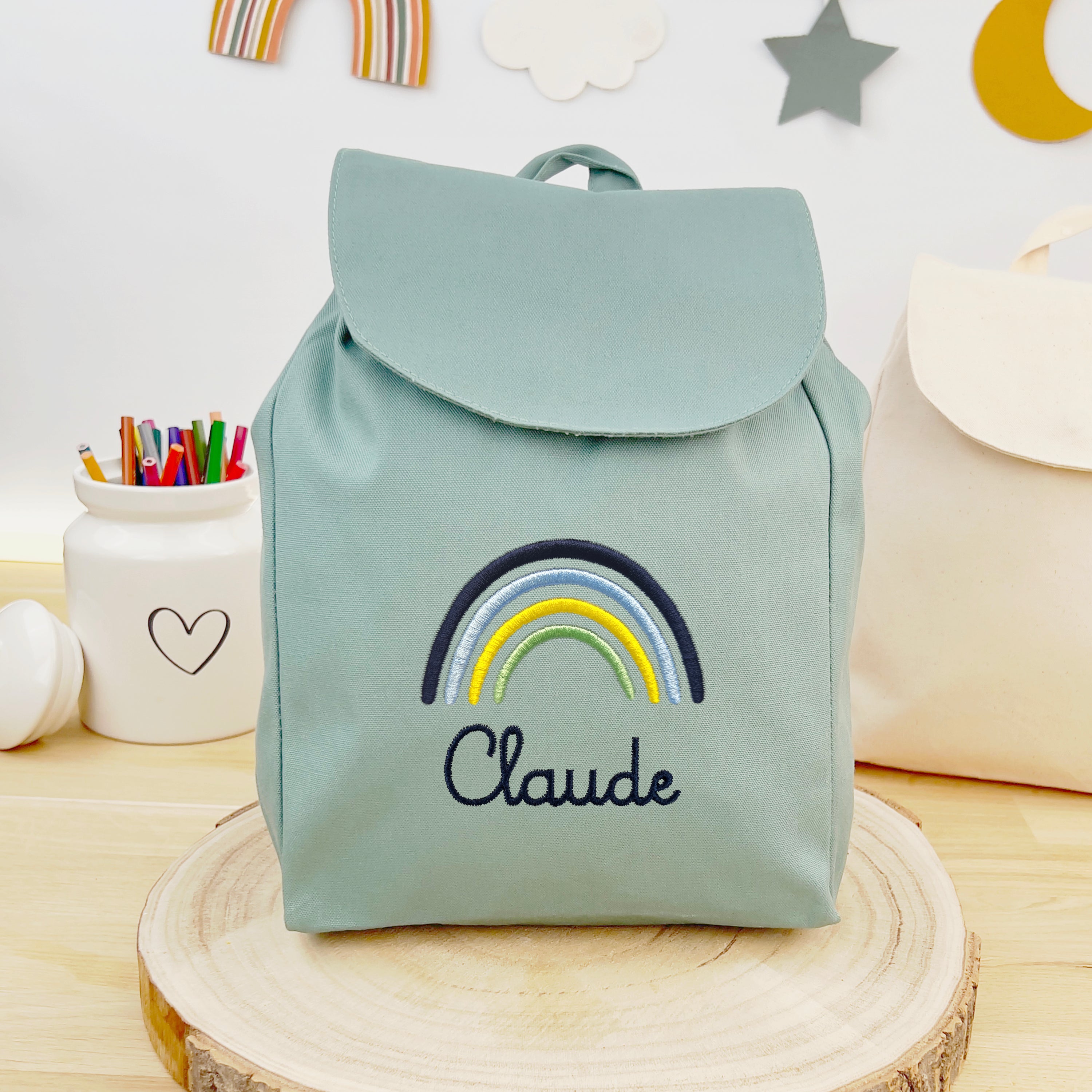 Bio Kinderrucksack mit Namen und Regenbogen - Mint/Navy